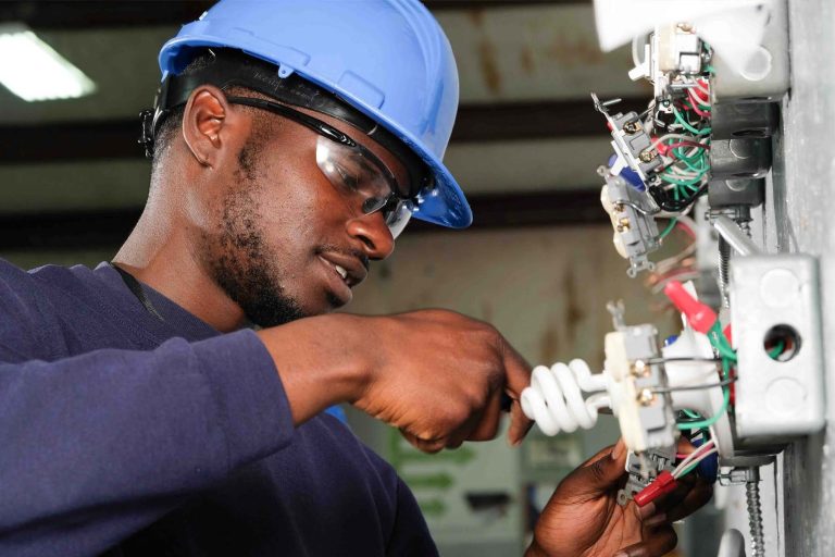 Black Man doing electrician work as a trade - Heroes United
