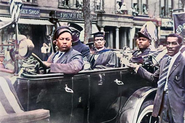Marcus-Mosiah-Garvey-in-car-with-friend-Heroes-United