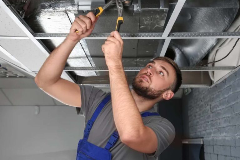 Mentee doing HVAC work in the ceiling- Heroes United