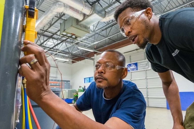 Mentor teaching a Mentees HVAC work - Heroes United