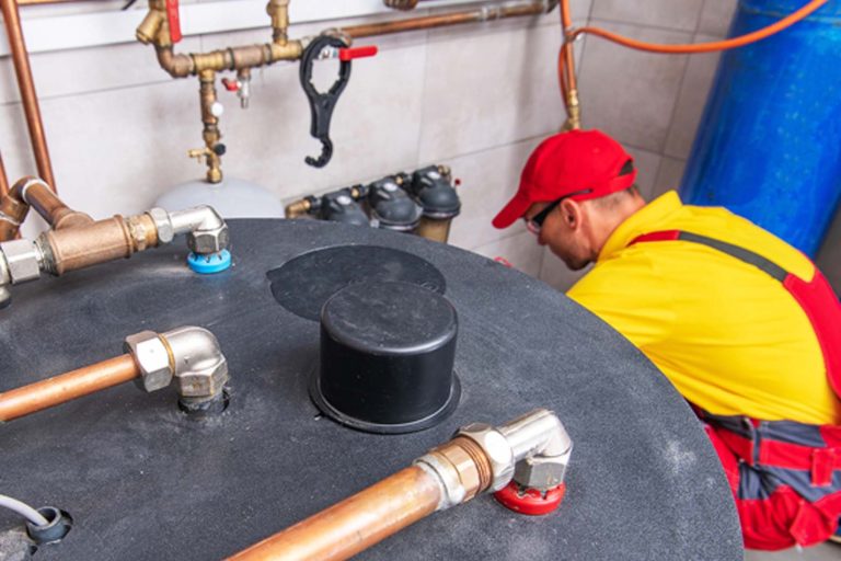 Plumber working on a boilder - Heroes United