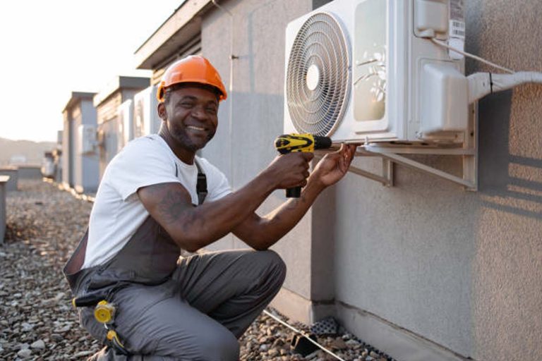 happy Mentee doing HVAC work on the roof - Heroes United