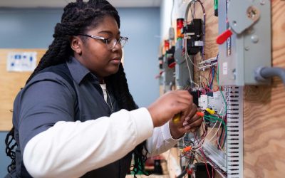 Black Woman doing electrician work as a trade in class - Heroes United